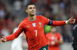 Cristiano Ronaldo - Portrait with red jersey and celebration.